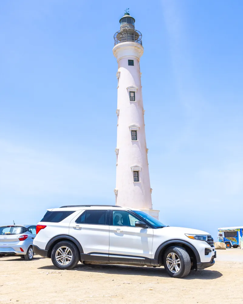 A rental SUV by the California lighthouse